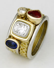 'Stacking Ring multi-stone' in platinum and 18K gold with two Diamonds, blue Sapphire and a Ruby